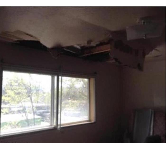 Roof of local home damaged after a storm