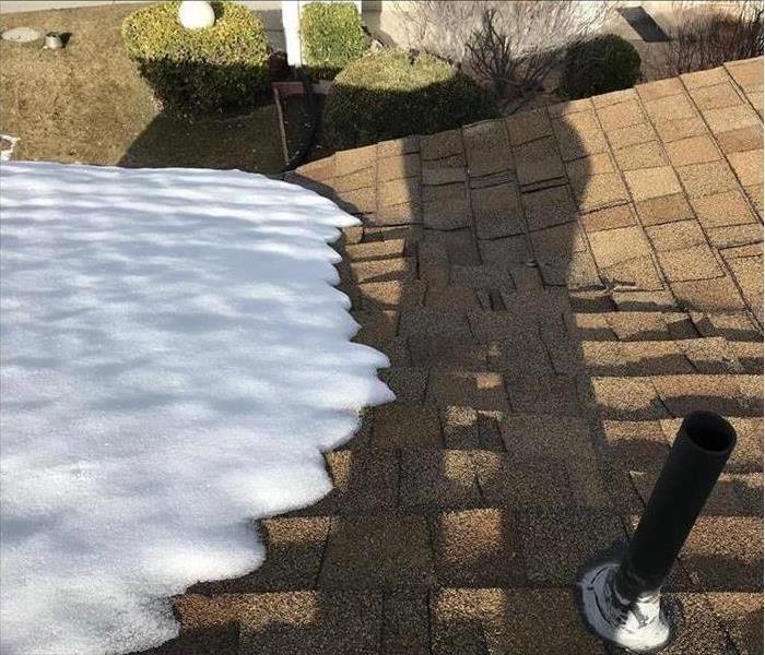 Ice dam causes damage to a roof 